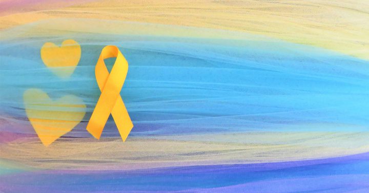 Yellow ribbon on a blue and yellow backdrop